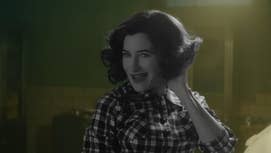 A still from Agatha All Along showing the titular character in a morgue, dressed in a 50s style look, she's in black and white while everything else is in colour.