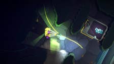 Still from Feed the Deep showing a diver exploring a deepsea cave, some kind of machine with a map on it can be seen.