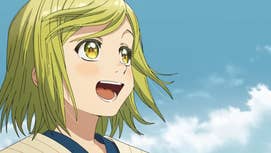 A young girl with grassy green hair and golden eyes is stood smiling, blue sky behind her in Witch Hat Atelier.
